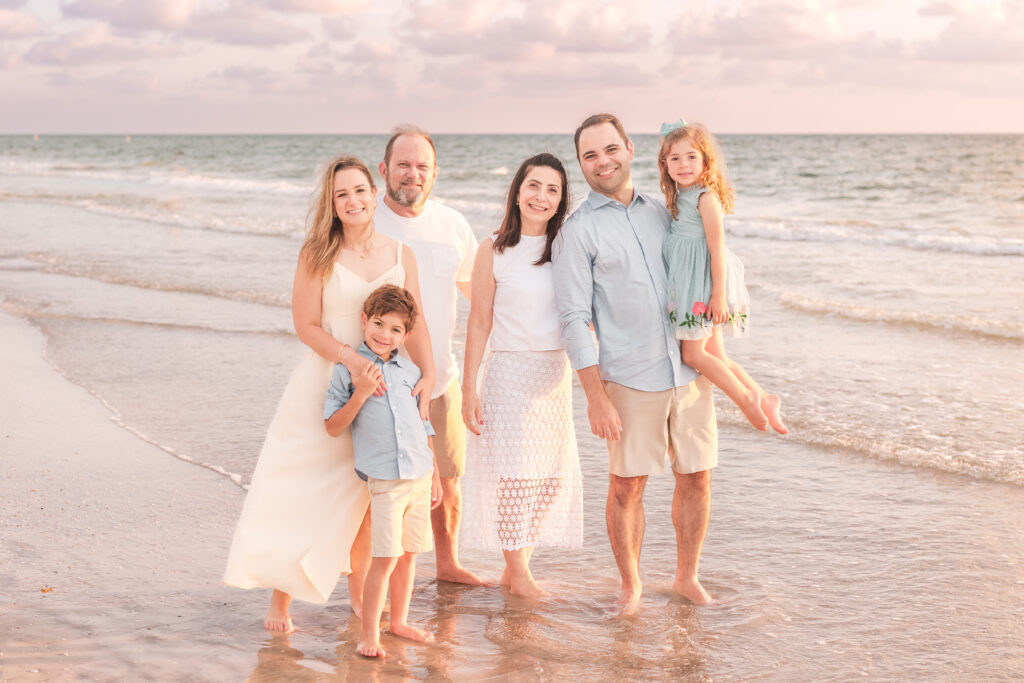 Extended family portrait with grandparents at Clearwater Beach sunrise