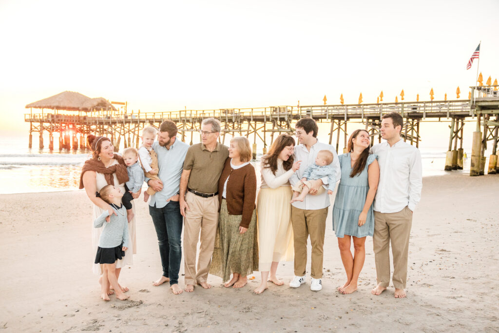 Professional photographer capturing family moments at golden hour on Cocoa Beach